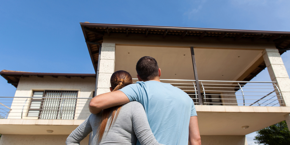 Couple Looking at House